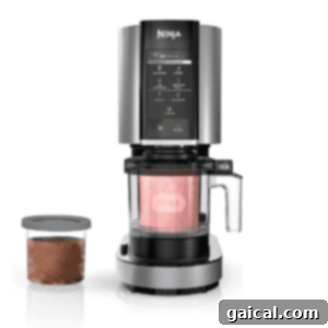 Decadent Chocolate Brownie Protein Creami Ice Cream 3 The Ninja CREAMi ice cream maker, a sleek kitchen appliance with a blending chamber, intuitive control panel, and an additional container for making various creamy frozen desserts like protein ice cream.