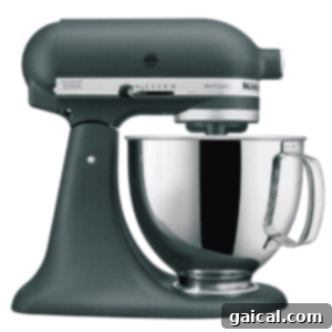 Maple Mallow Cloud 3 A dark green KitchenAid stand mixer.