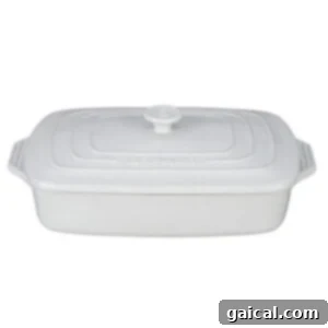 Zesty Greek Chicken and Orzo Bake 4 White casserole dish.