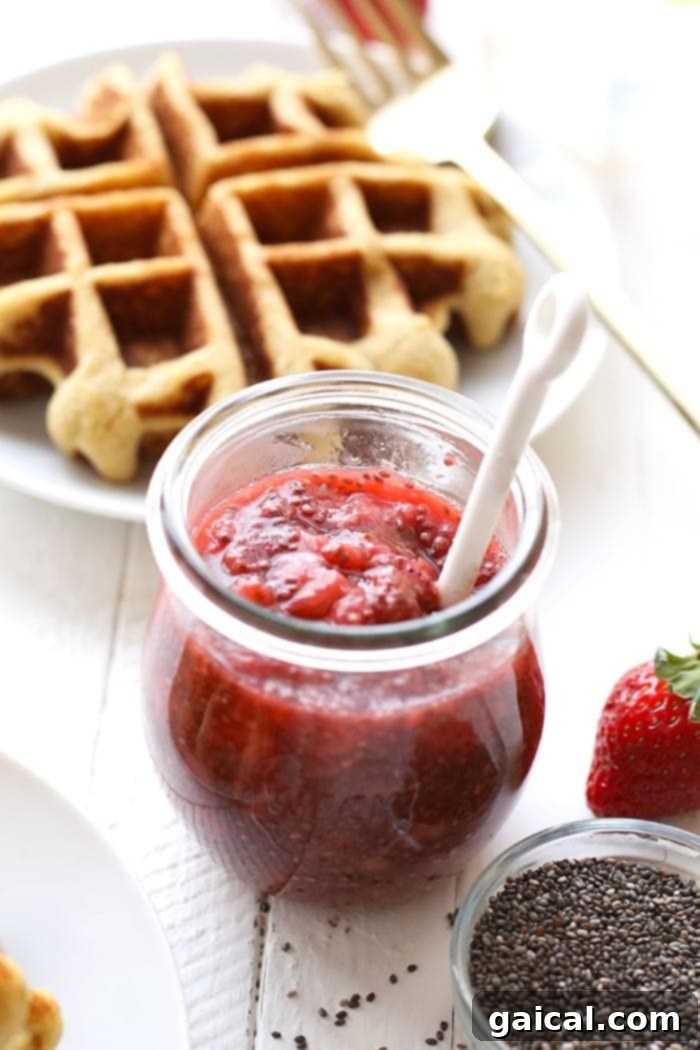 Fresh Strawberry Chia Compote Homemade strawberry chia compote cooling in a glass jar, ready to be served or stored.