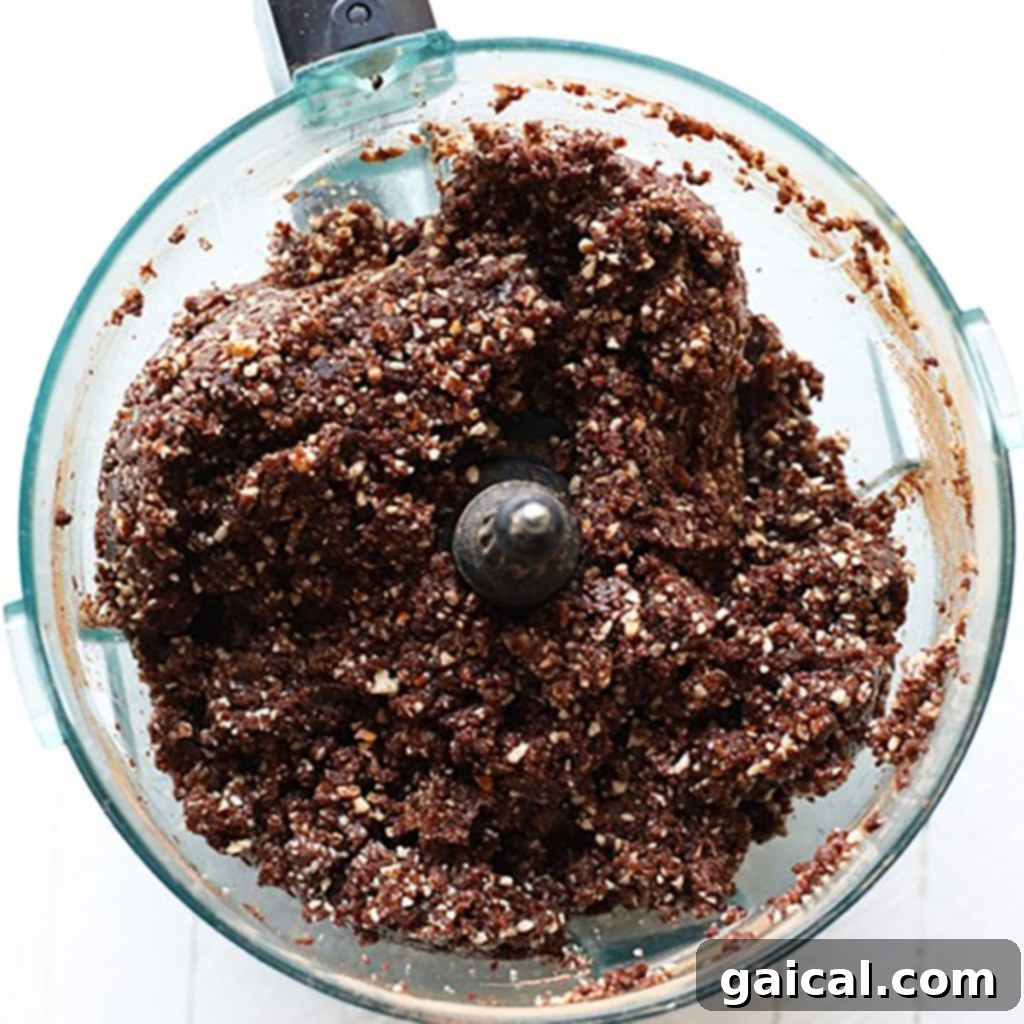 Peanut Butter Brownie Energy Bites 3 Ground peanut butter brownie balls mixture of ingredients in a food processor.