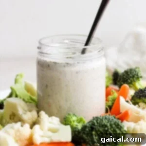 A jar of homemade ranch dressing, perfectly creamy and ready to serve.