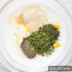 All ranch ingredients in a bowl, ready for whisking.