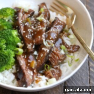 Sous vide flank steak and broccoli in a white bowl.
