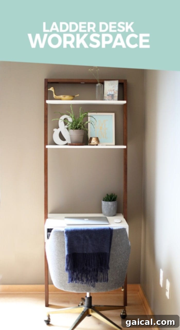 DaFunkShow's Creative Den 3 Stylish West Elm Ladder Desk with plants, blending seamlessly into an open-concept living space next to a kitchen.