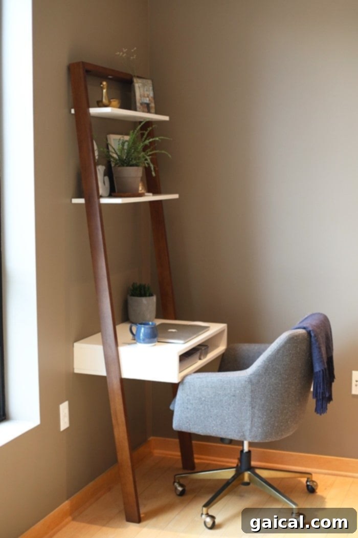 DaFunkShow's Creative Den 5 Detailed shot of the West Elm Ladder Desk, featuring workspace essentials and decorative items, highlighting its clean design.