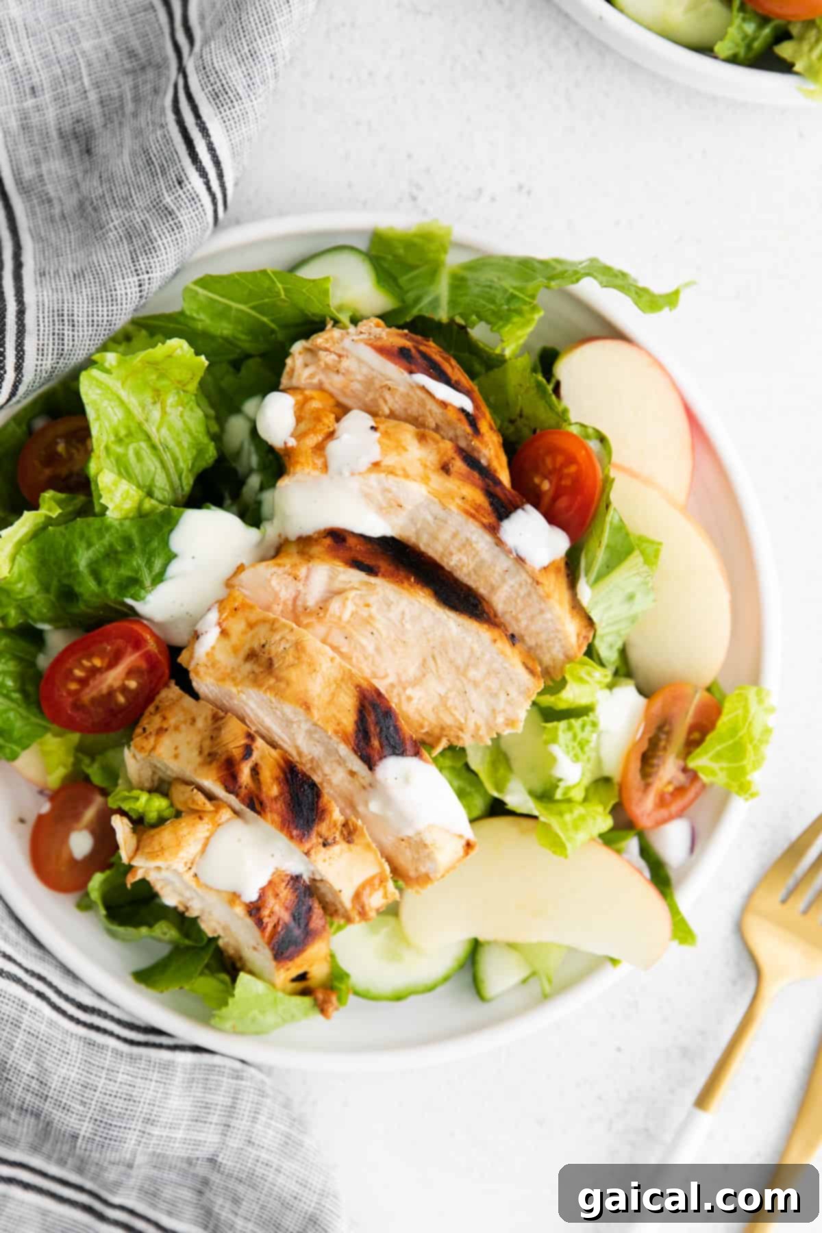 A selection of various chicken salads presented in different bowls.