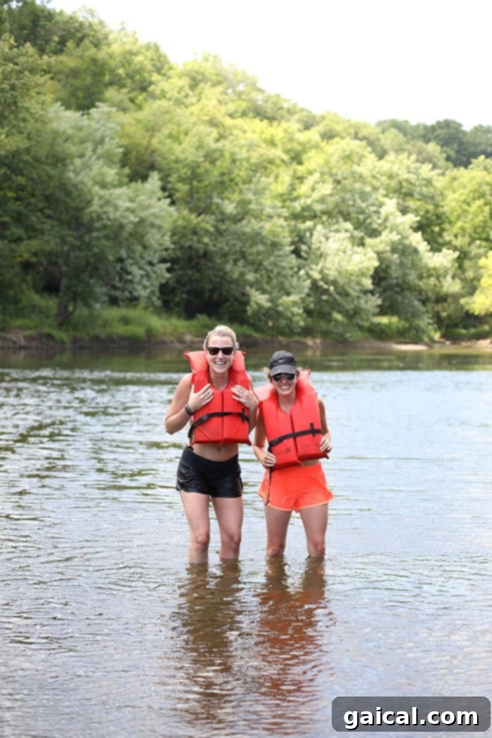 Paddle Cannon River and Savor Red Barn Pizza: Minnesota's Perfect Pairing 7 Close-up of friends enjoying snacks and drinks in their canoe.