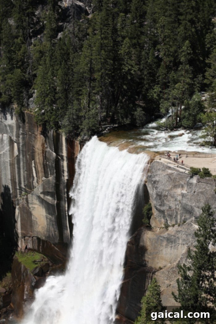 Fit Foodie Yosemite 48 Hour Itinerary 21 A hiker making their way down the wet Mist Trail in Yosemite