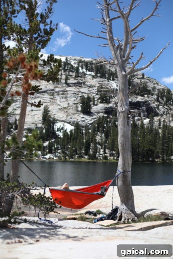Fit Foodie Yosemite 48 Hour Itinerary 25 Couple enjoying lunch by Lower Cathedral Lake on an ENO Hammock