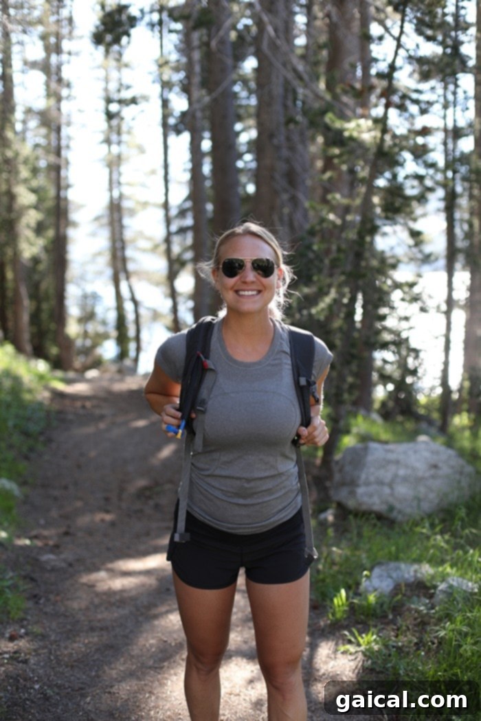 Fit Foodie Yosemite 48 Hour Itinerary 8 Couple hiking with Half Dome in the background, Yosemite National Park
