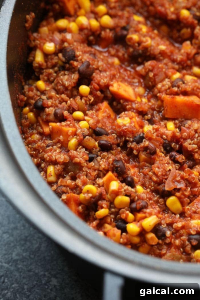 Whip up this savory Slow Cooker Mexican Quinoa for a pantry-staple meal that's also naturally vegan and gluten-free! Fully cooked Mexican quinoa in the slow cooker