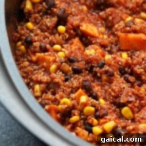 A slow cooker filled with Mexican quinoa after cooking.