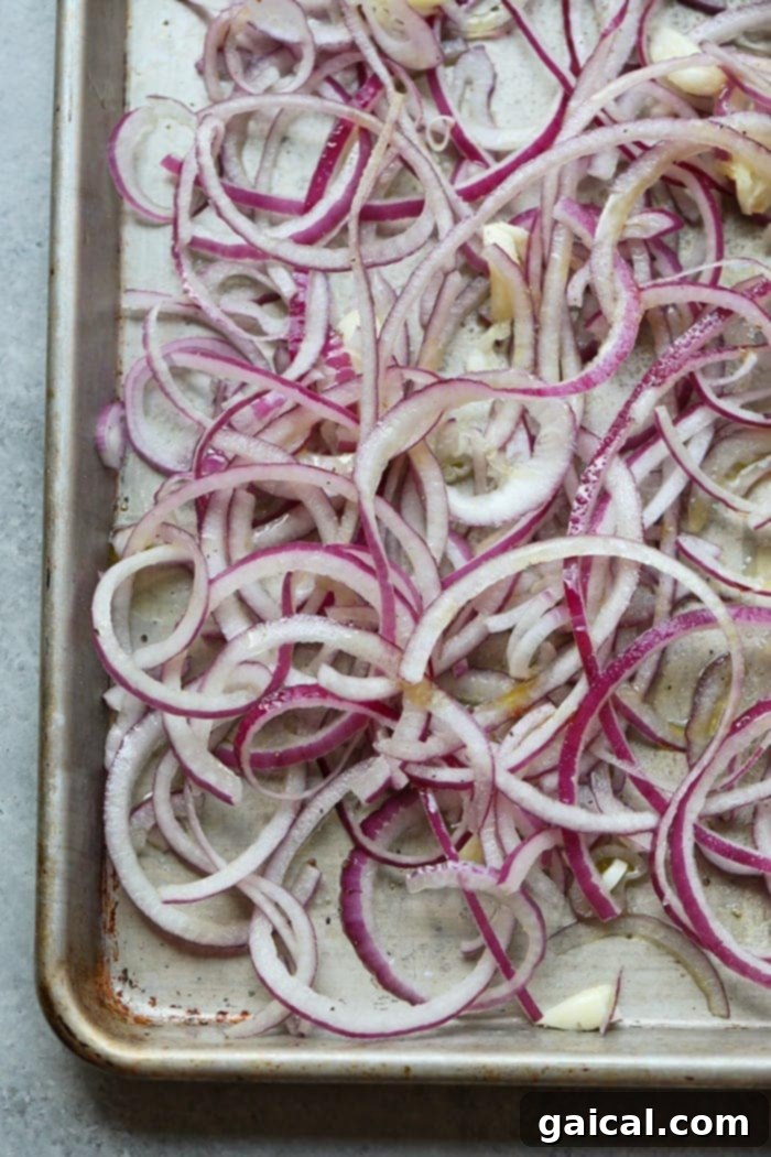 Caramelized onions gracefully roasting in the oven, beginning to turn a beautiful golden hue.