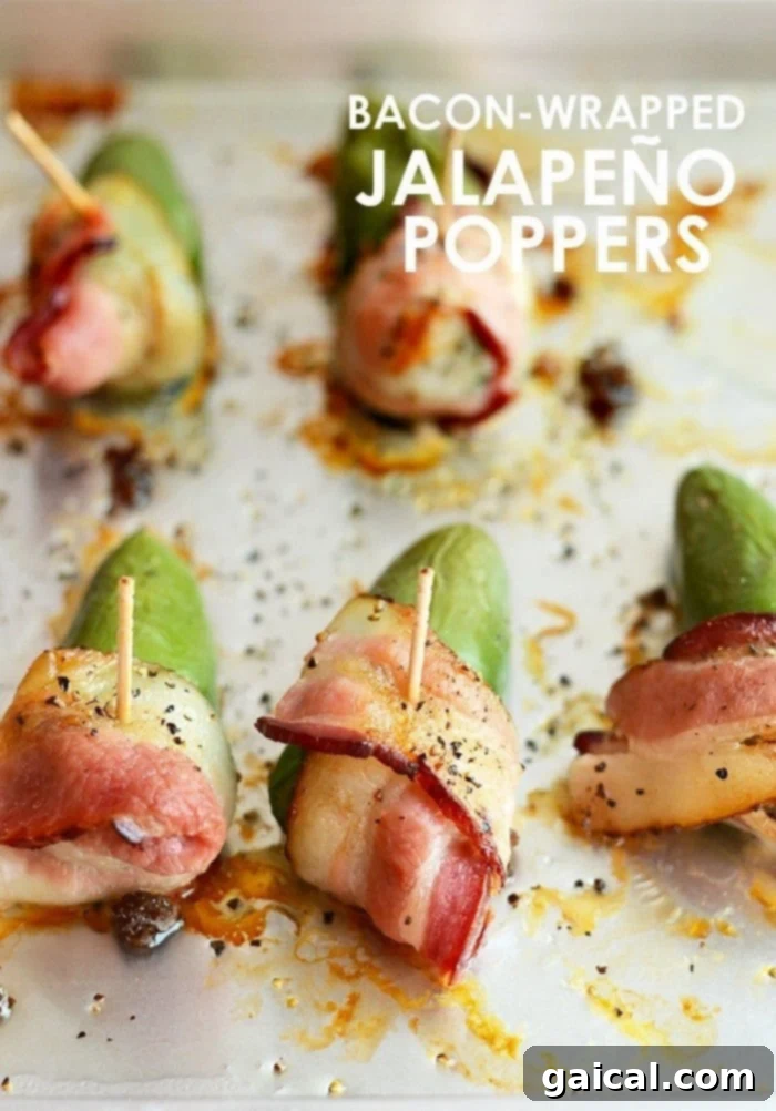Crispy bacon-wrapped jalapeño poppers, golden brown and bursting with flavor, served on a platter.