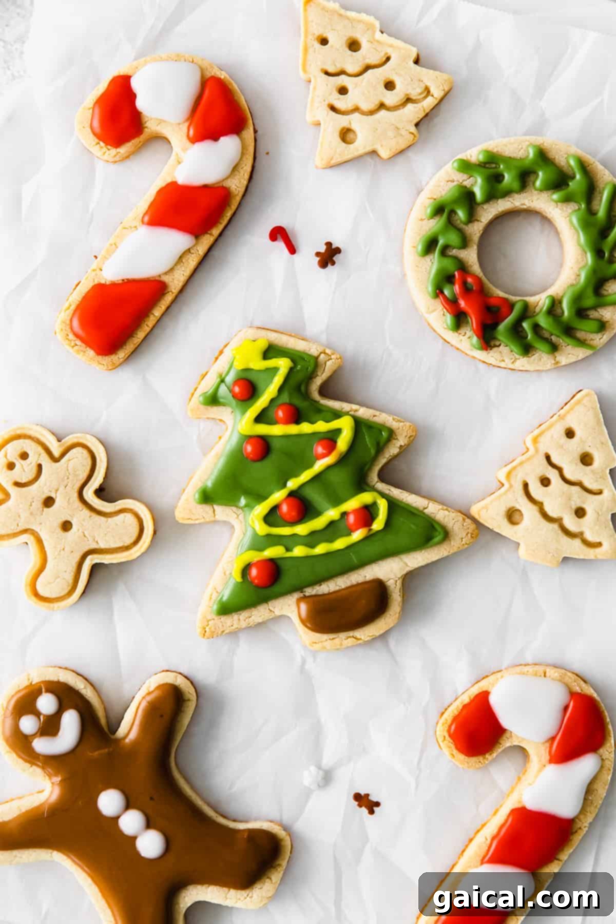 Grain-Free & Refined Sugar-Free Almond Flour Christmas Cookies Beautifully decorated Christmas almond flour sugar cookies on a baking sheet, ready for holiday festivities.