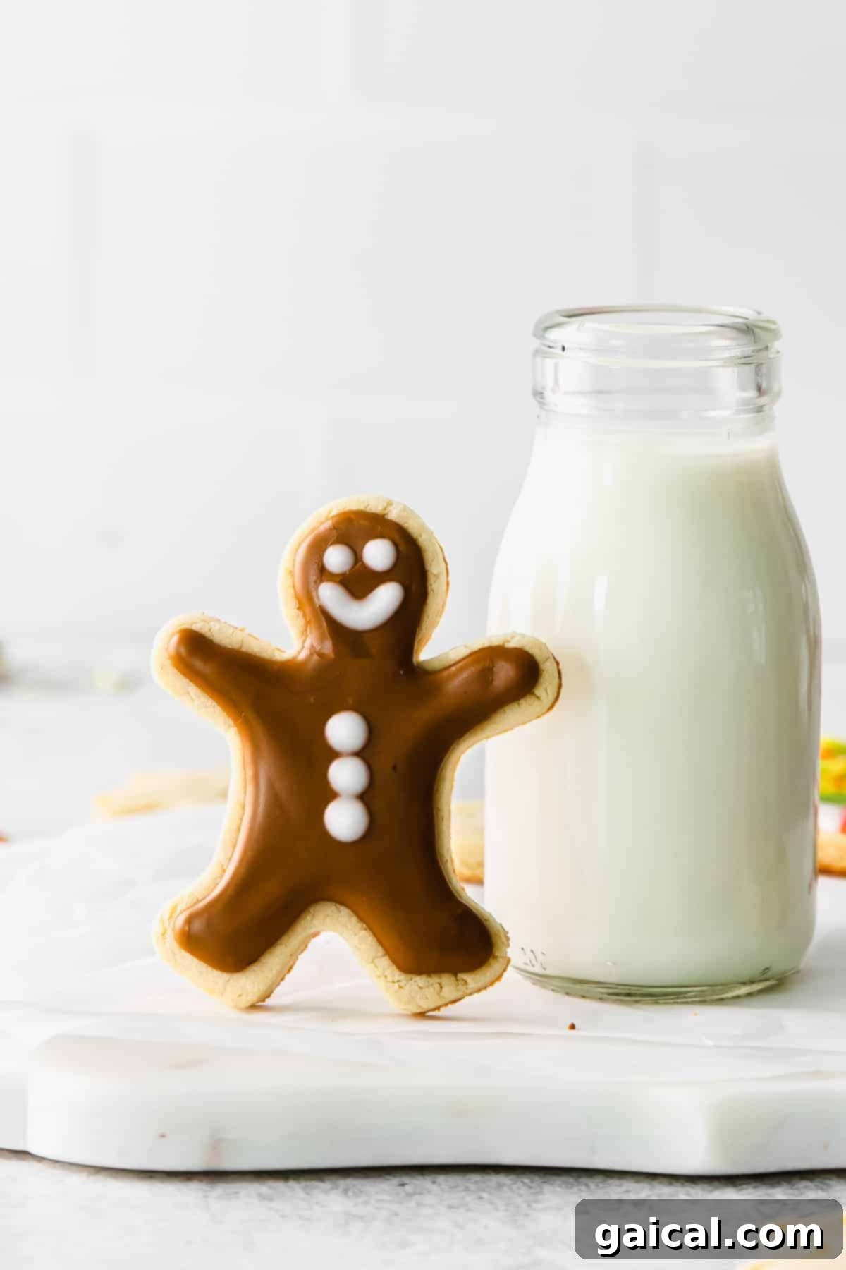 Enjoying Healthy Almond Flour Sugar Cookies A stack of delicious sugar-free almond flour cookies beautifully arranged next to a glass of milk, inviting a delightful treat moment.