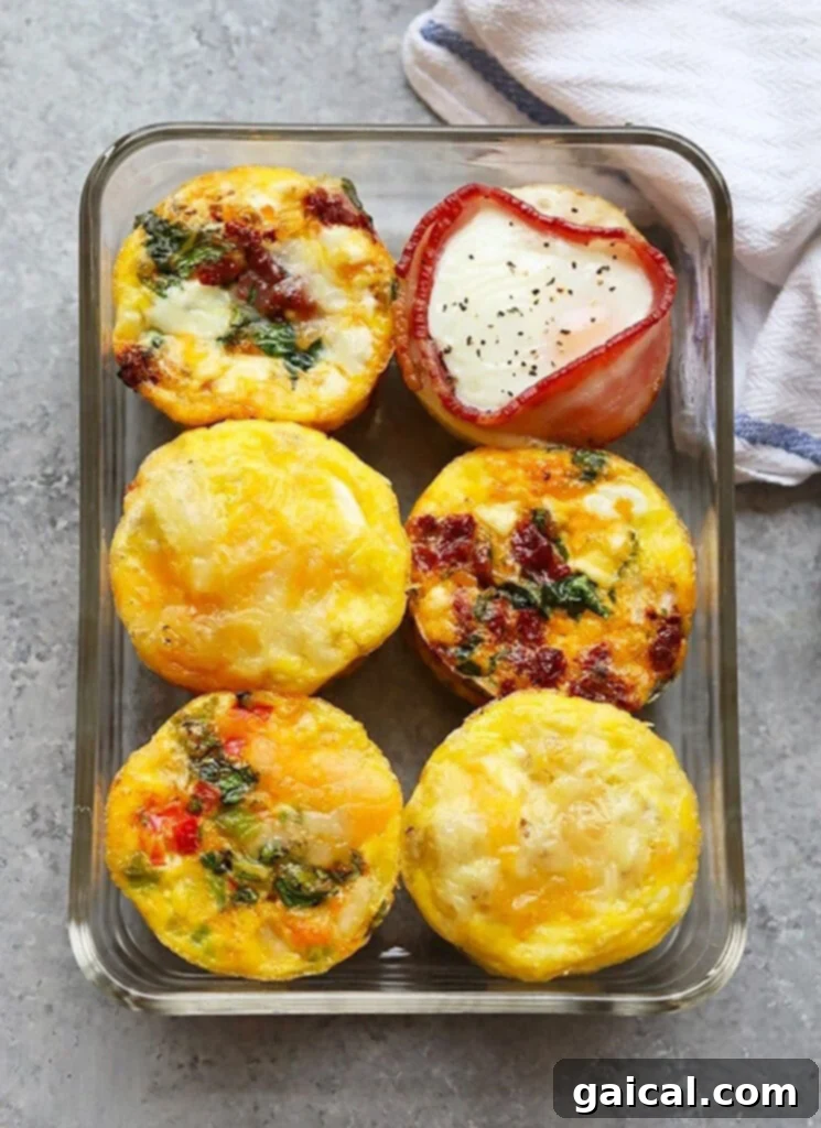 prepared egg cups neatly arranged in a meal prep container, ready for a week of healthy breakfasts.