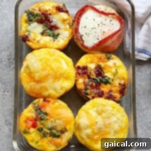 Breakfast egg cups baked in a glass dish, showcasing the variety of fillings.