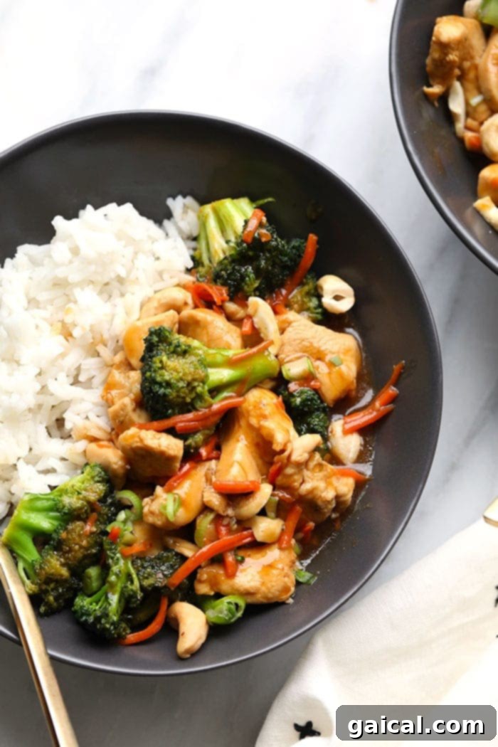 Quick and Easy Chicken Stir Fry 2 A vibrant bowl of homemade chicken stir fry with rice, featuring tender chicken, crisp broccoli, and bright carrots, ready to be enjoyed.