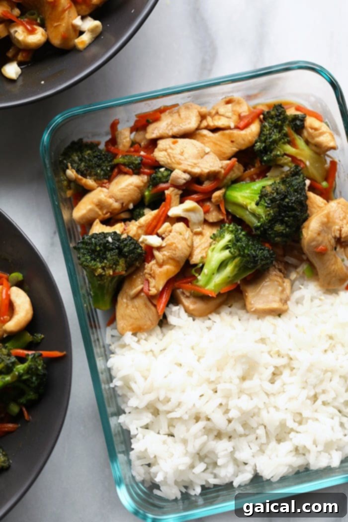 Quick and Easy Chicken Stir Fry 5 Prepared chicken stir fry in a clear glass meal prep container, ready for easy transport and reheating.