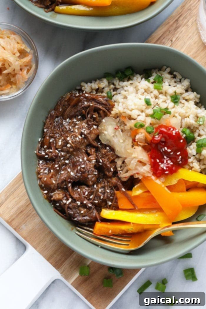 Instant Pot Korean Beef Bowls: Tender Shredded Beef A vibrant Instant Pot Korean Beef Bowl, garnished with fresh ingredients.