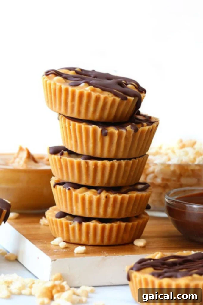 A beautifully arranged stack of crunchy peanut butter cups on a wooden board, ready to be served.