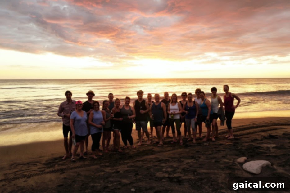 Travel to Nicaragua for a yoga and surf retreat! A group of happy travelers enjoying the beautiful beach scenery, ideal for a Nicaragua surf and yoga retreat.