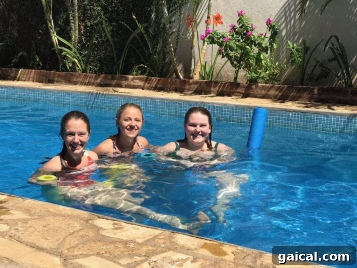 Hotel con Corazon is a botique hotel in Granada, Nicaragua! Travel to Granada for a vacation. Women enjoying the refreshing pool at Hotel con Corazon, a boutique hotel in Granada, Nicaragua.
