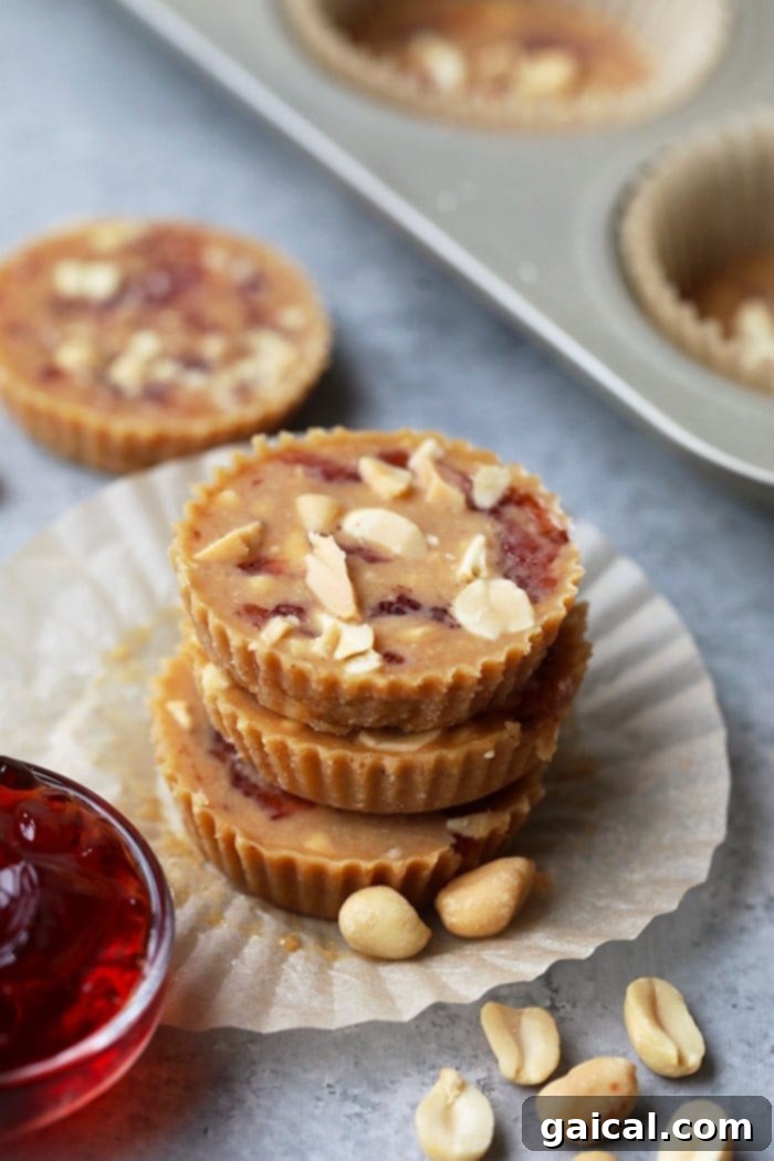 Healthy, Protein-Packed Crunchy Peanut Butter and Jelly Fat Bombs for Keto and Meal Prep Stack of irresistible Crunchy Peanut Butter and Jelly Fat Bombs