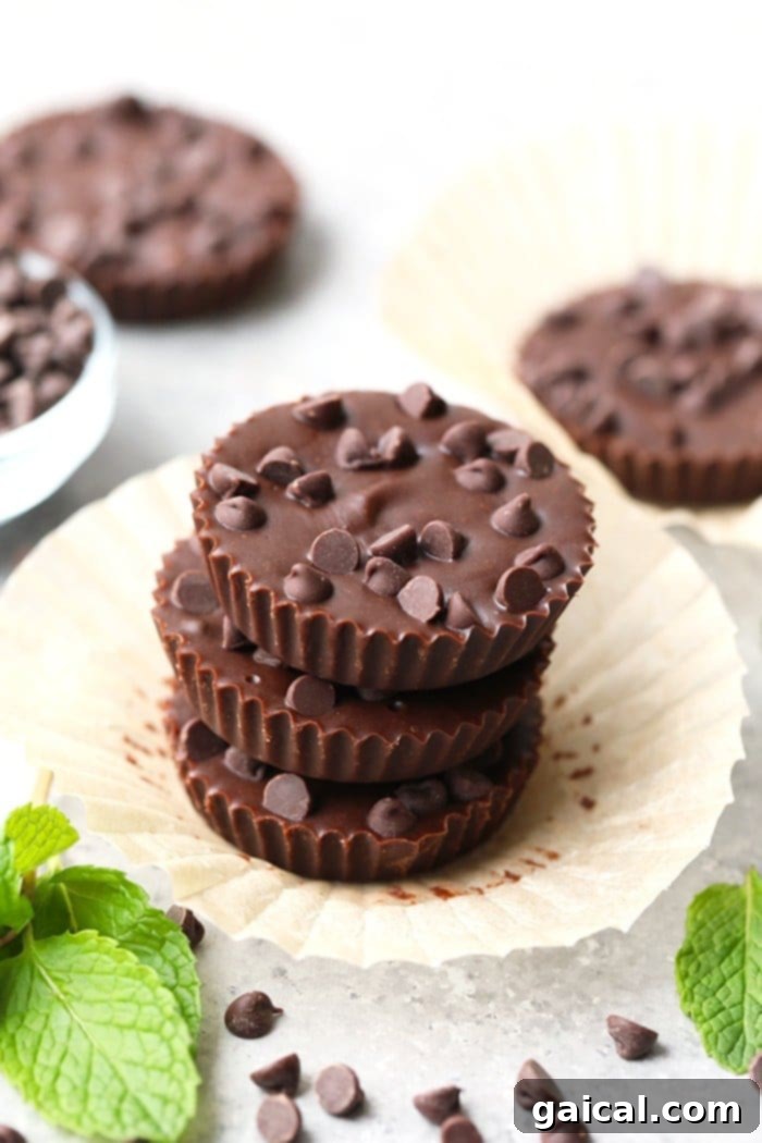 Perfectly crafted Thin Mint Almond Butter Cups, a healthy indulgence waiting in your freezer. A batch of delicious Thin Mint Almond Butter Cups, perfectly set and ready to enjoy from the freezer.