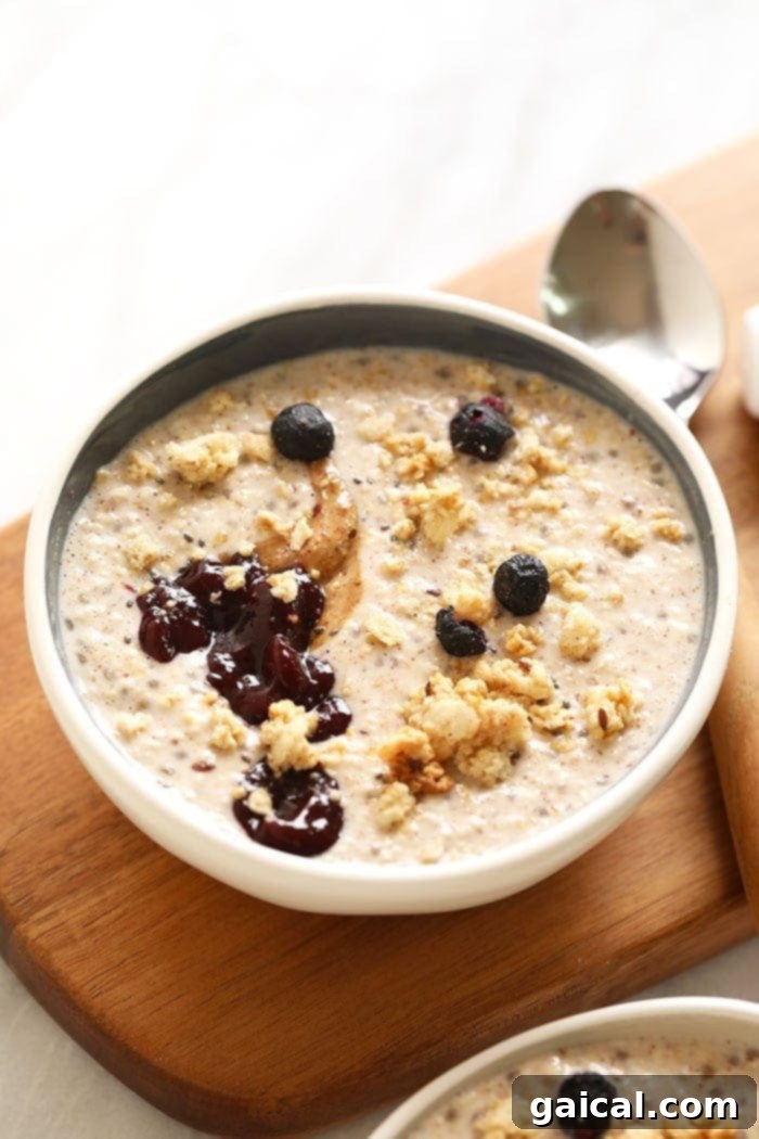 Balanced Vegan Breakfast: Steel Cut Oats with Berries A comforting bowl of steel cut oats topped with fresh berries and nuts, representing a balanced and wholesome vegan breakfast.