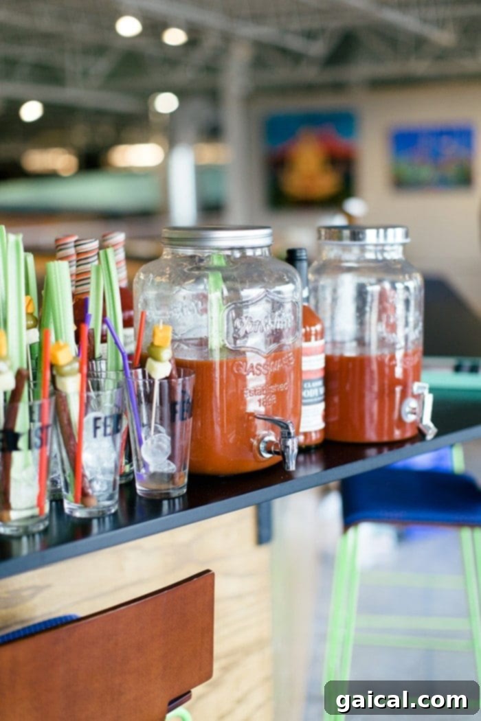 Bloody Mary Bar setup with various garnishes, organic mix, and Lorissa's Kitchen beef sticks, ready for guests.