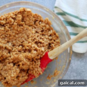 Ultimate Honey Peanut Butter Scotcheroos 4 scotcheroos in bowl.