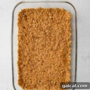 Ultimate Honey Peanut Butter Scotcheroos 5 rice crispies in pan.