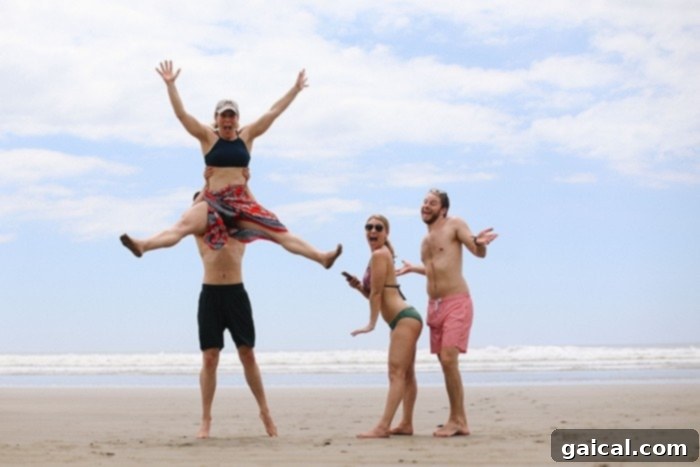 Fun times and jumping for joy on a pristine Costa Rican beach People joyfully jumping on a secluded beach in Costa Rica