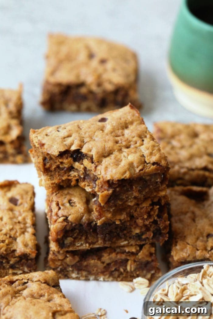 Delicious Peanut Butter Oatmeal Cookie Bars Stack of Peanut Butter Oatmeal Cookie Bars with chocolate chips
