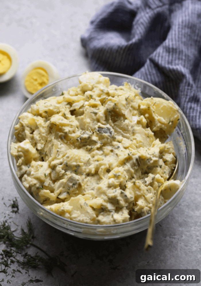 No-Fuss Instant Pot Potato Salad 2 Creamy Instant Pot Potato Salad served in a large bowl, garnished with fresh dill.