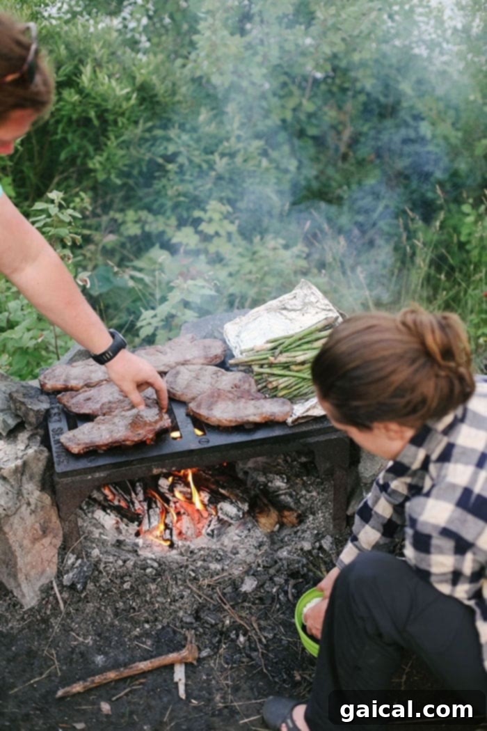 Delicious Campfire Dinner in the Boundary Waters Campsite cooking over an open fire in the BWCA