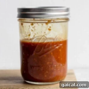 A glass mason jar filled with homemade stir fry sauce, ready for various Asian-inspired dishes.