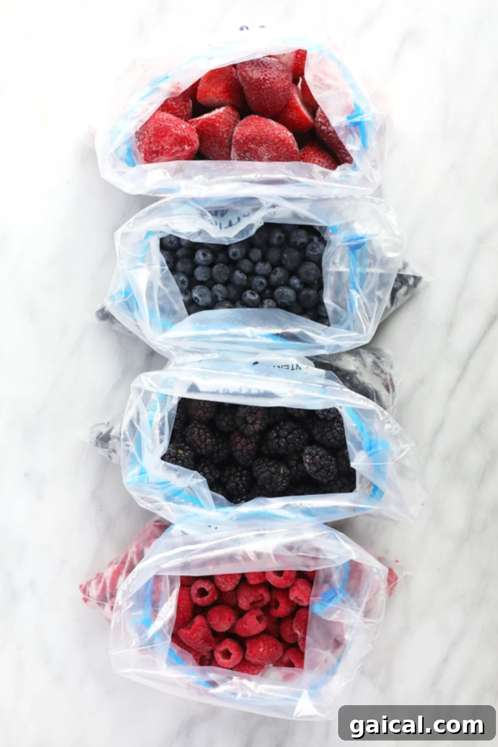 Frozen Berries in Ziploc Bags Assortment of individually frozen berries ready to be transferred into storage bags