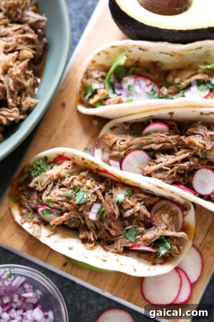Is there anything better than fall off the bone pork carnitas tacos? Learn how to make the most delicious and juicy Instant Pot Pulled Pork Carnitas recipe with a few simple ingredients. carnitas tacos