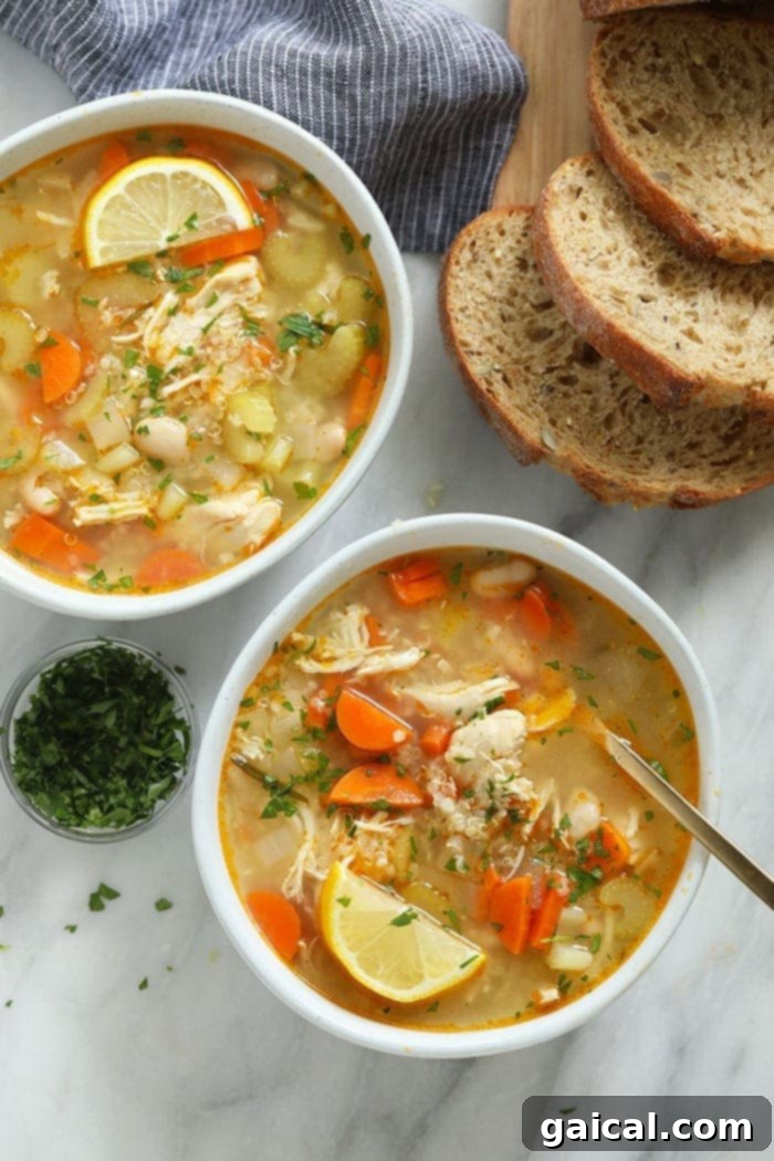 Healthy Chicken Quinoa Soup: Protein-Packed, Gluten-Free & Flavorful Chicken quinoa soup in bowls, garnished with fresh herbs