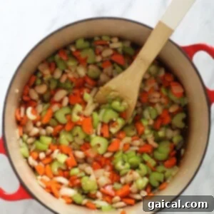 Soul-Soothing Chicken Quinoa Medley 2 Sautéed vegetables and aromatics for chicken quinoa soup
