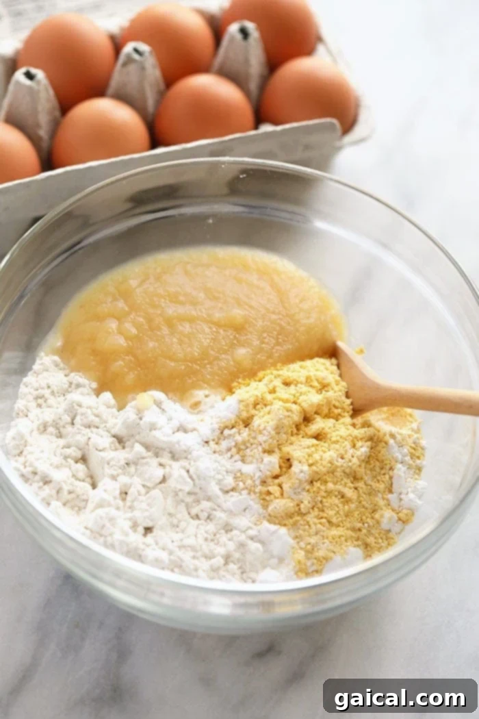 Essential Ingredients for Gluten-Free Cornbread Pancakes Various pancake ingredients, including cornmeal and gluten-free flour, displayed in bowls.
