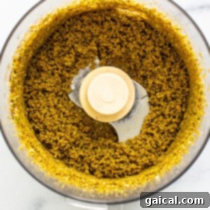 Pistachios being processed into a smooth butter in the food processor.