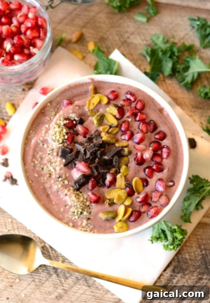 53 Game-Changing Plant-Based Recipes 13 Fancy Pomegranate Green Smoothie Bowl with toppings.
