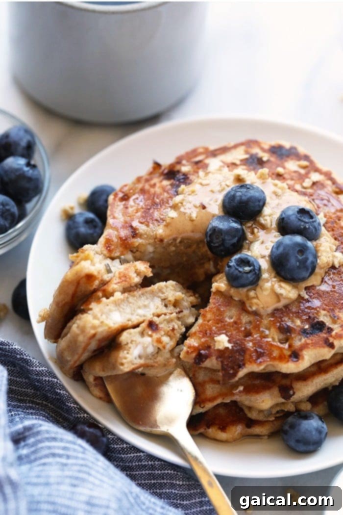 53 Game-Changing Plant-Based Recipes 4 Fluffy cottage cheese protein pancakes stacked high with syrup.