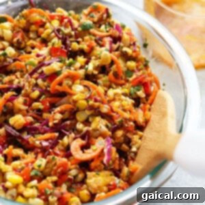 A vibrant bowl of Summer Corn Salad, showcasing perfectly grilled corn, colorful vegetables, and the rich dressing, ready to be enjoyed.