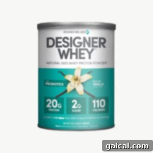 Top Protein Picks for 2023 8 designer whey protein powder. A tub of Designer Whey Protein Powder, showcasing its classic branding and vanilla flavor.